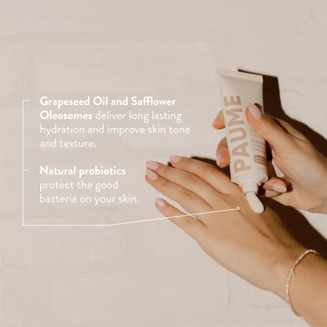 PAUME balm being applied to hands demonstrating quick absorption benefit