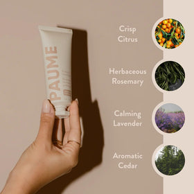 PAUME tube next to everyday items showing 2 oz travel-friendly benefit
