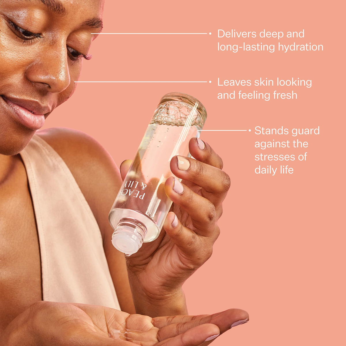 Peach & Lily essence on hand being patted in showing quick absorption and plumping benefit