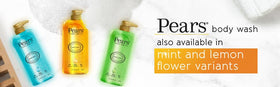 Drops of natural oils beside Pears bottle indicating conditioning benefit