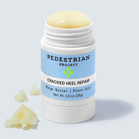 Pedestrian Project tube held in hand showing 1 oz travel-friendly benefit