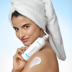 Perfect Image bottle next to hand to show product size and travel-friendly benefit