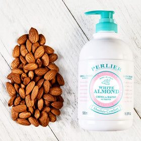 Perlier almond ingredients arranged to show cold-pressed Italian almond oil benefit