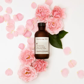Perricone MD bottle in hand showing 4 fl oz scale and travel-friendly benefit
