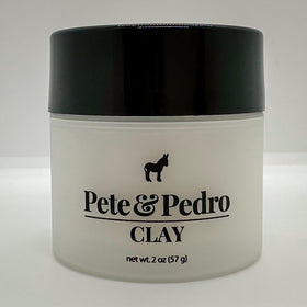 Pete & Pedro clay next to coin for scale showing the 2 oz travel-friendly size