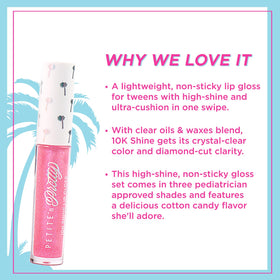 Petite 'N Pretty mini gloss beside key to show compact travel-friendly size
