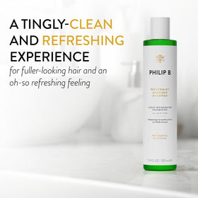 PHILIP B shampoo pouring into hand creating rich lather, refreshing cleanse