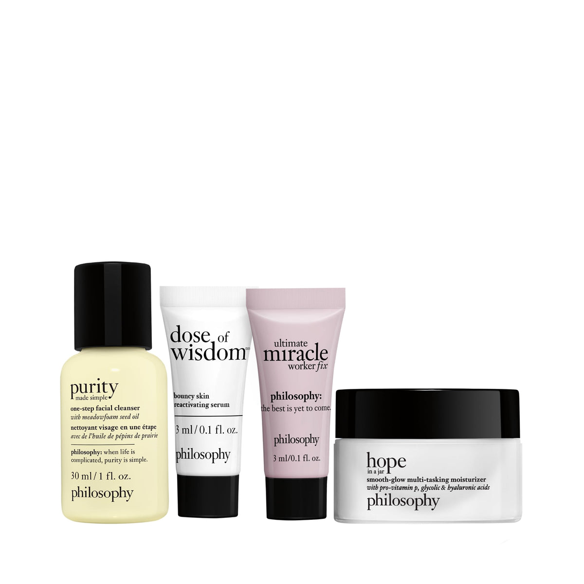philosophy minis lined up on white surface displaying cleanser, serum, eye treatment, and moisturizer neatly