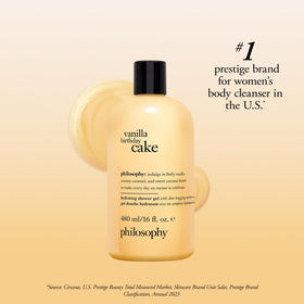 philosophy bottle next to a hand to show 16 fl oz scale and portability