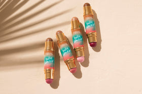 Physicians Formula shade swatches on arm illustrating pigment payoff and buildable glow