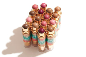 Physicians Formula travel-ready flatlay with stick and minimal essentials for packing light