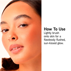Physicians Formula brush swiped across pan demonstrating easy blendability