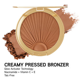 Physicians Formula next to coin to show compact size and travel-friendliness