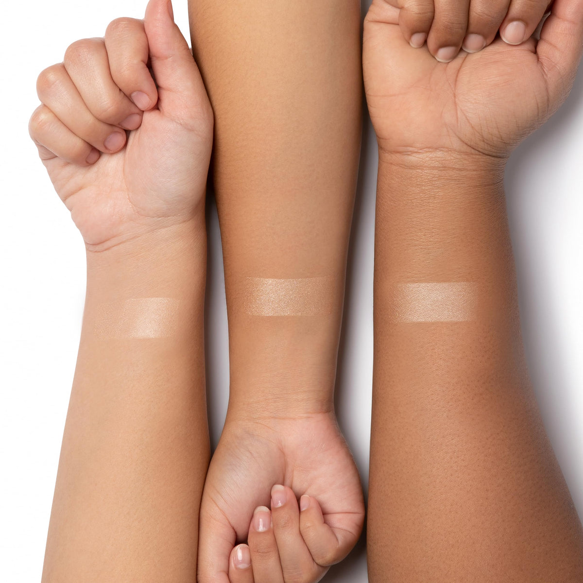 Physicians Formula swatch on hand demonstrating blendable sheen and buildable pigmentation