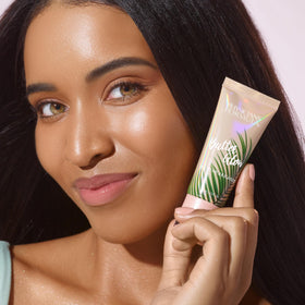 Physicians Formula applied to model cheekbones showcasing natural glow and dimensional highlight