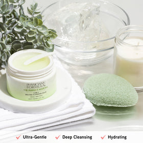 Physicians Formula balm applied to cheek being massaged away to dissolve makeup gently