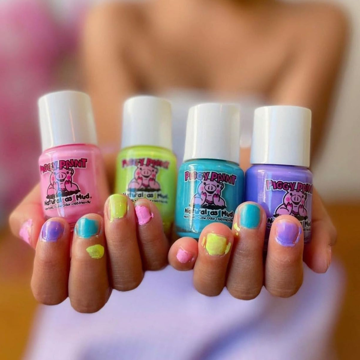 Piggy Paint polish applied on child nails showcasing low-odor, gentle finish