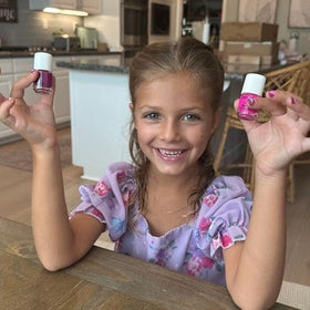 Piggy Paint being applied to child's hands illustrating kid-friendly use