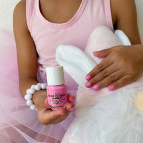 Piggy Paint gift box styled on table perfect for presentable, safe kids' manicure
