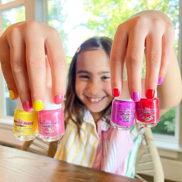 Child having nails painted with Piggy Paint in a family-friendly, low-odor activity