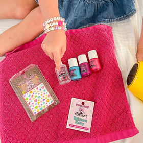 Piggy Paint kids painting nails together demonstrating safe fun