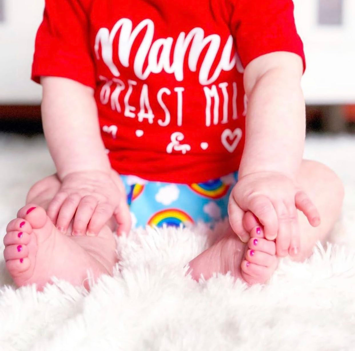 Lifestyle scene of a child enjoying a Piggy Paint manicure in a cozy room
