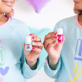 Piggy Paint lifestyle scene of child doing manicure in bedroom playtime