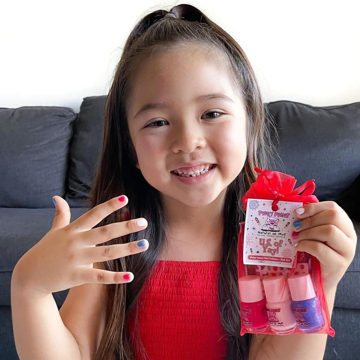 Piggy Paint on child hands lifestyle shot showing safe-looking fun at home