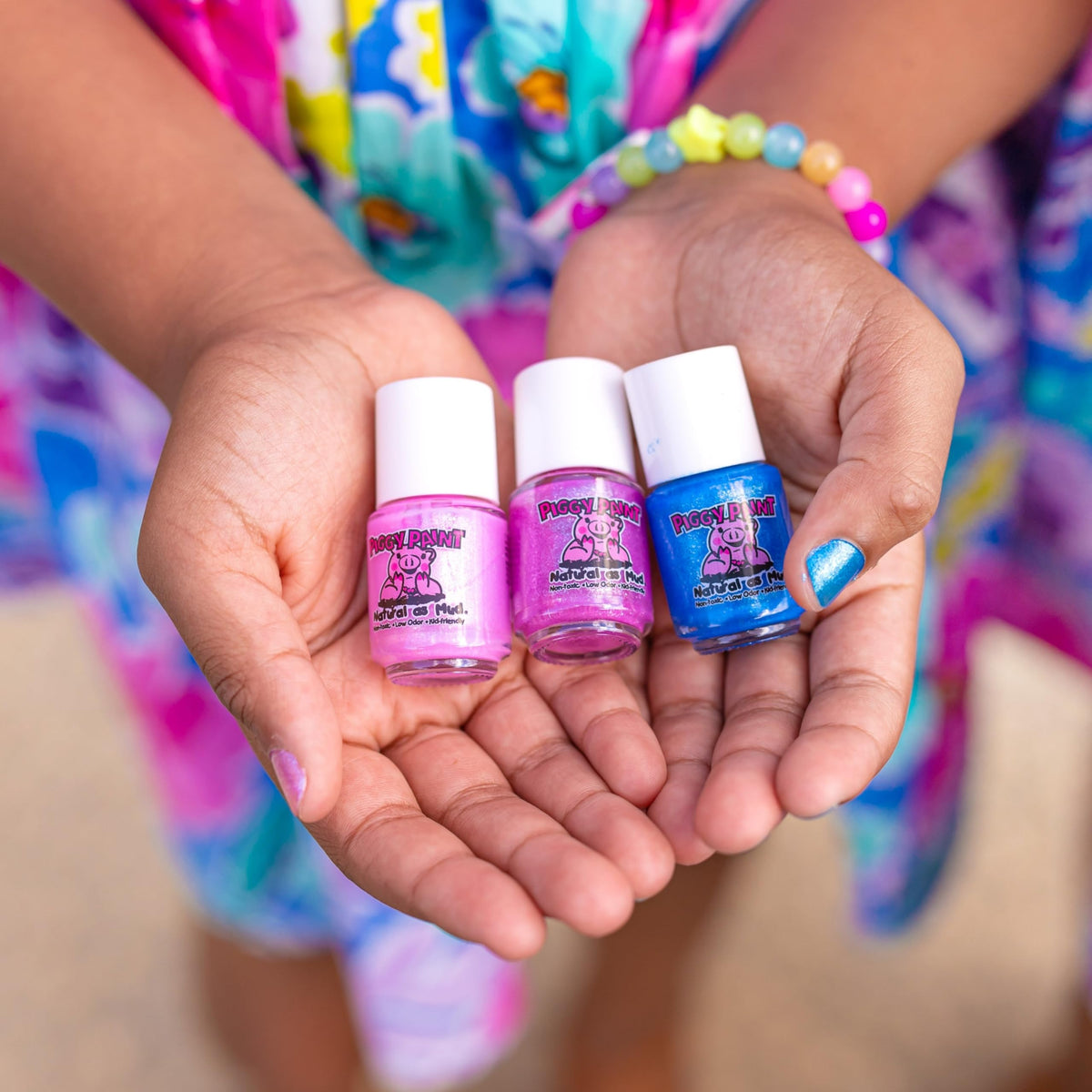 Piggy Paint polishing on a child nail showing gentle safe use for families