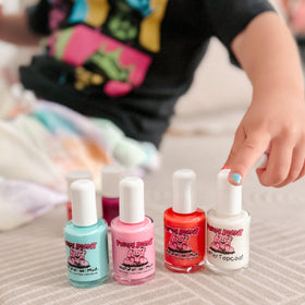Piggy Paint painted hand display demonstrating bright seafoam manicure benefit