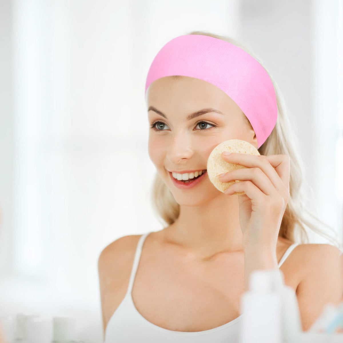 PINKXHY headband on bathroom vanity with skincare products, ideal for home routines