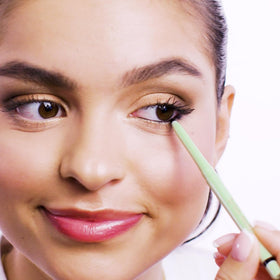 Pixi pencil beside coin showing compact travel-friendly size benefit