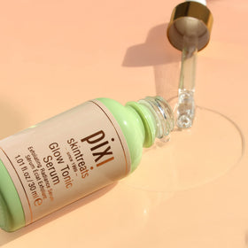 Pixi Glow Tonic Serum texture on pipette showing lightweight consistency for layering