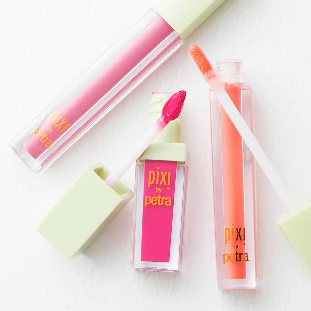 pixi over lipstick lifestyle shot showing added shine and enhanced color payoff benefit