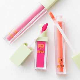 pixi over lipstick lifestyle shot showing added shine and enhanced color payoff benefit