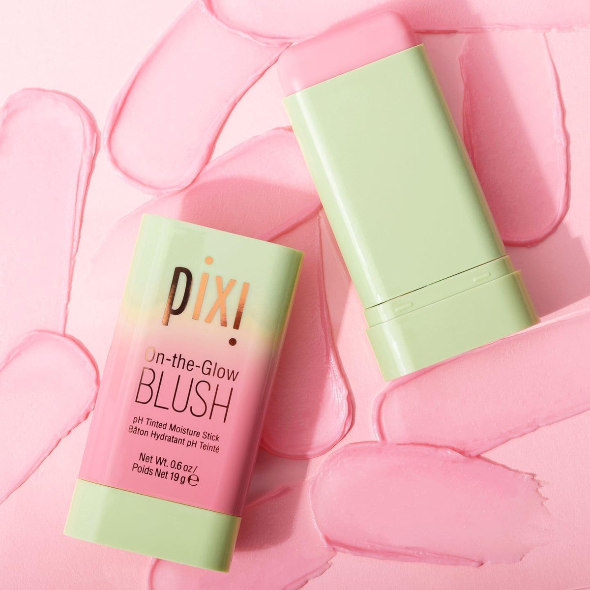 Pixi On-the-Glow scale with hand showing compact, travel-friendly size