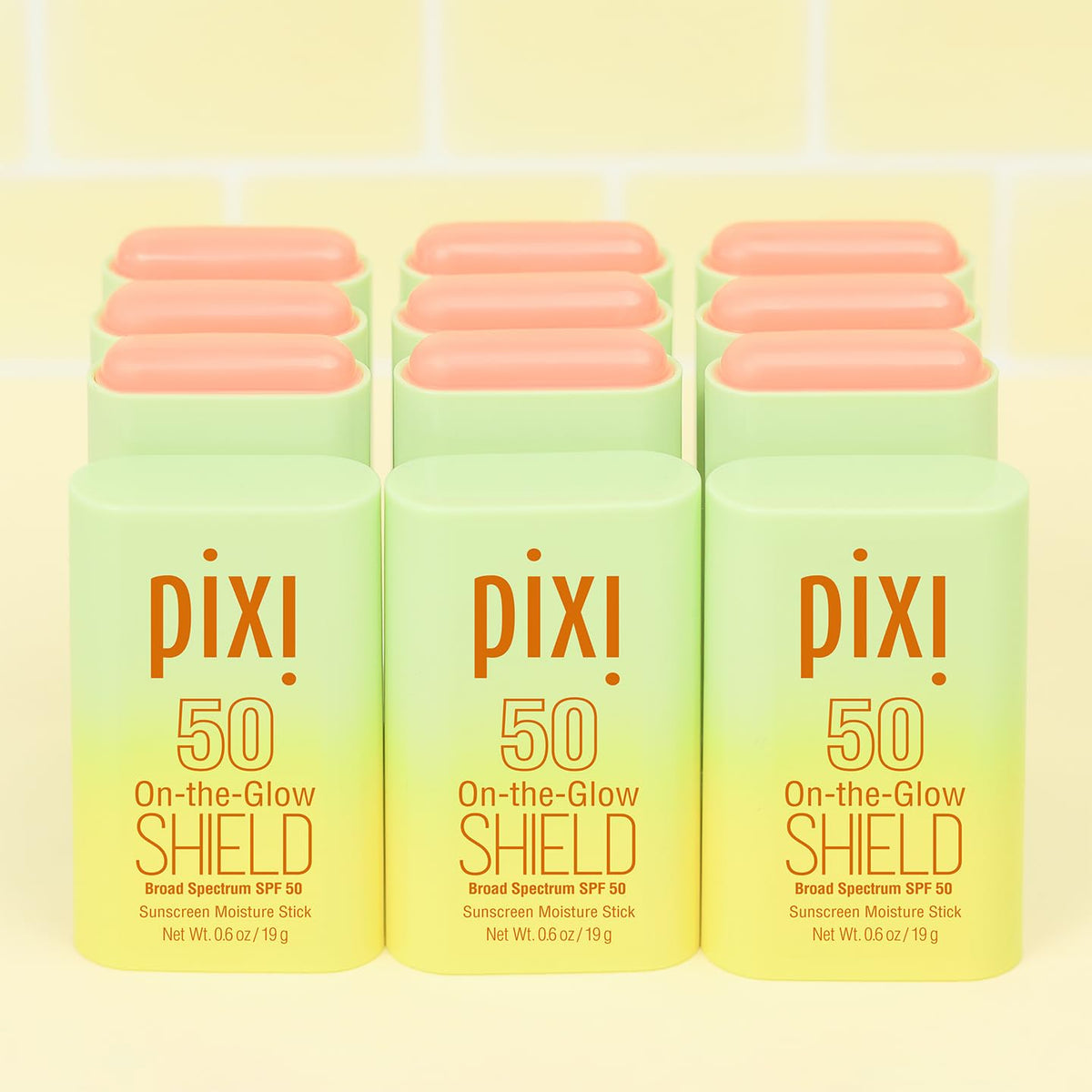 Person using Pixi stick outdoors showing on-the-go sun protection