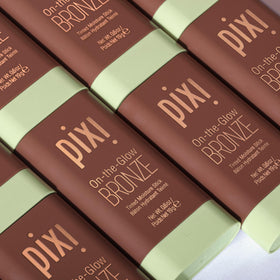 Pixi bronzer inside travel bag depicting on-the-go convenience and quick touch-up benefit