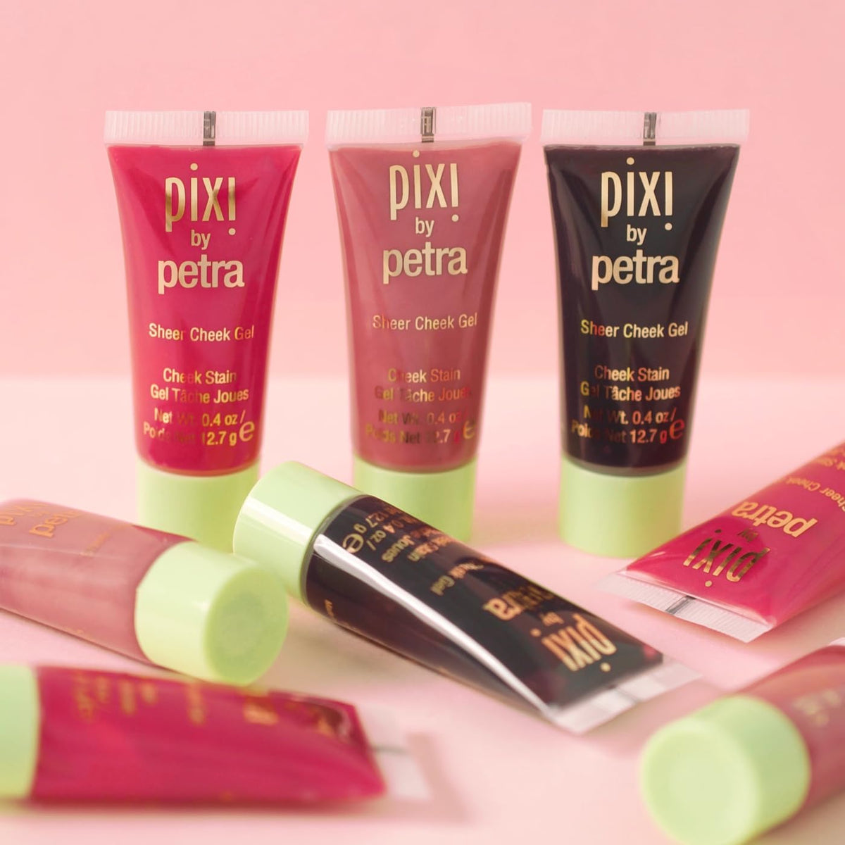 Pixi product beside coin showing size and travel-friendly volume
