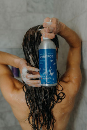 Plaine Products lather in hand demonstrating gentle sulfate-free cleansing benefit