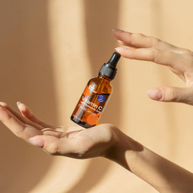 Plant Therapy 1 oz bottle next to coin demonstrating compact travel-friendly size