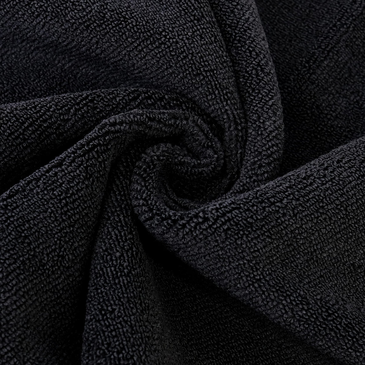 POLYTE towel beside a hand showing 16x29 in scale and coverage benefit