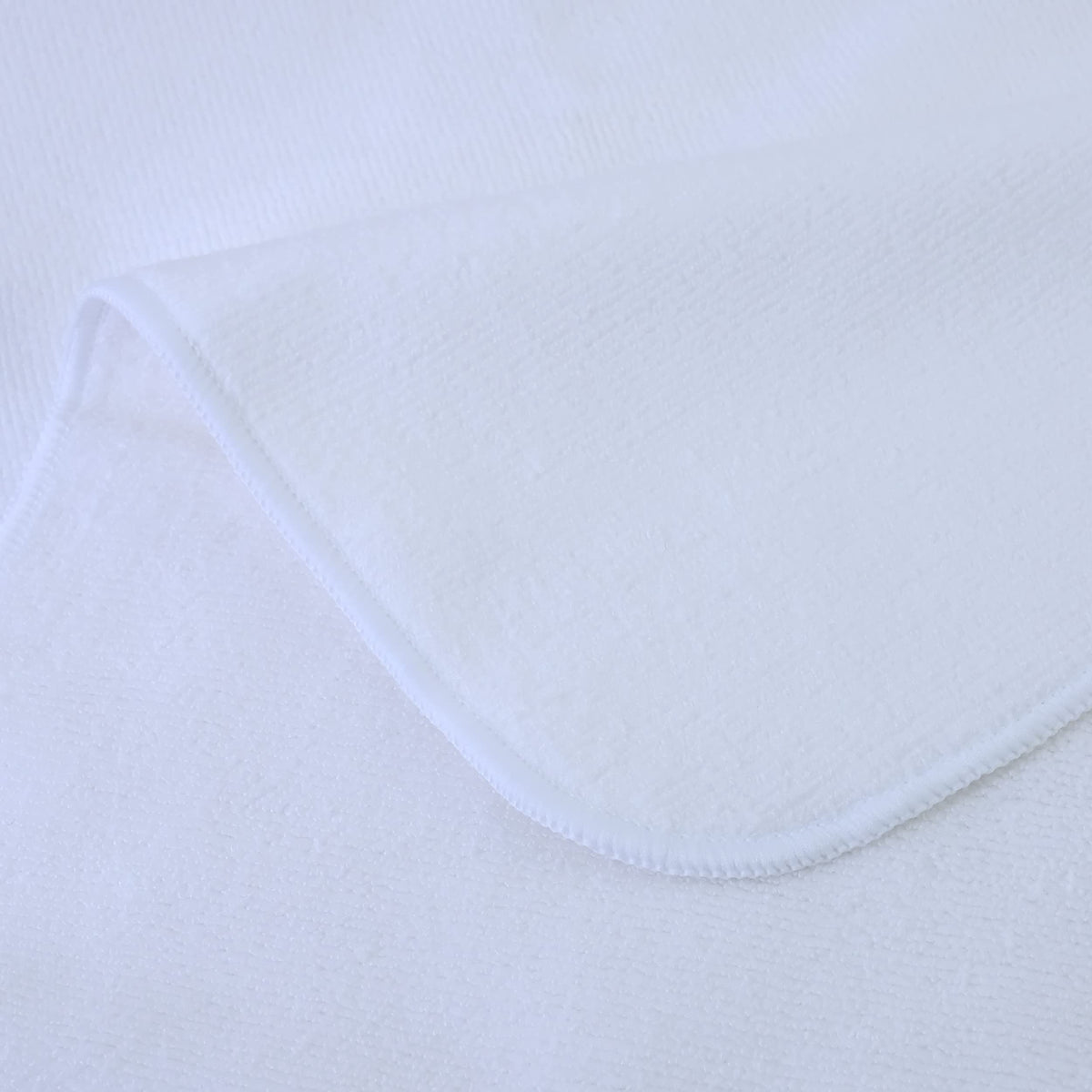 POLYTE towel held against hand showing 20x40 inch size for full hair coverage