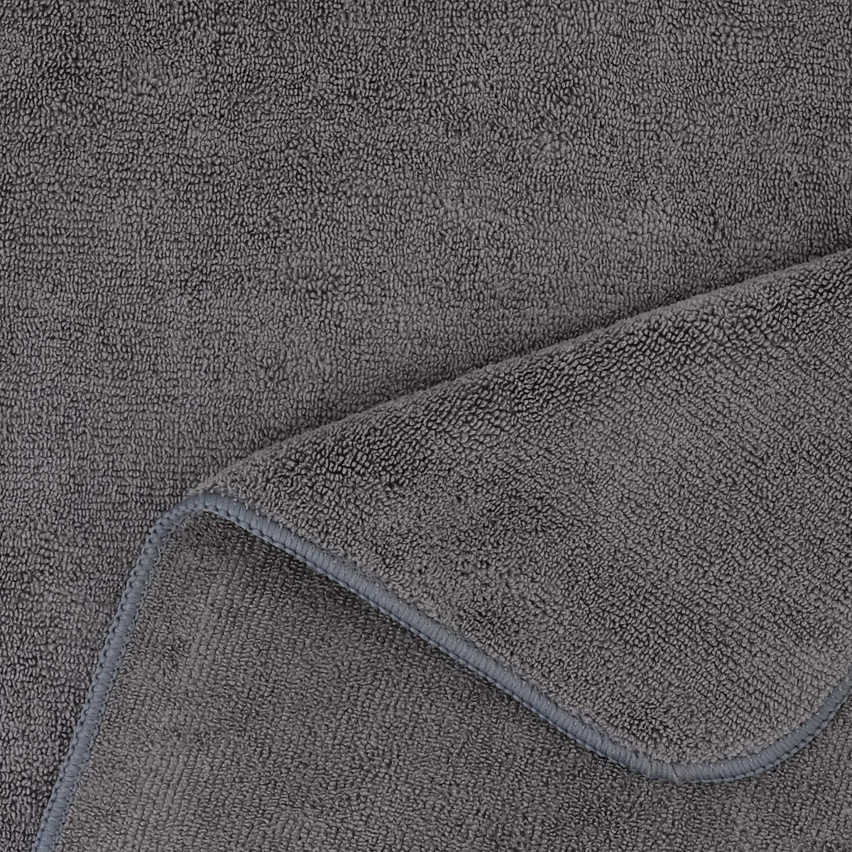POLYTE towel laid on chair next to ruler showing 20 by 40 inch coverage advantage