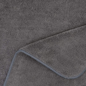 POLYTE towel laid on chair next to ruler showing 20 by 40 inch coverage advantage