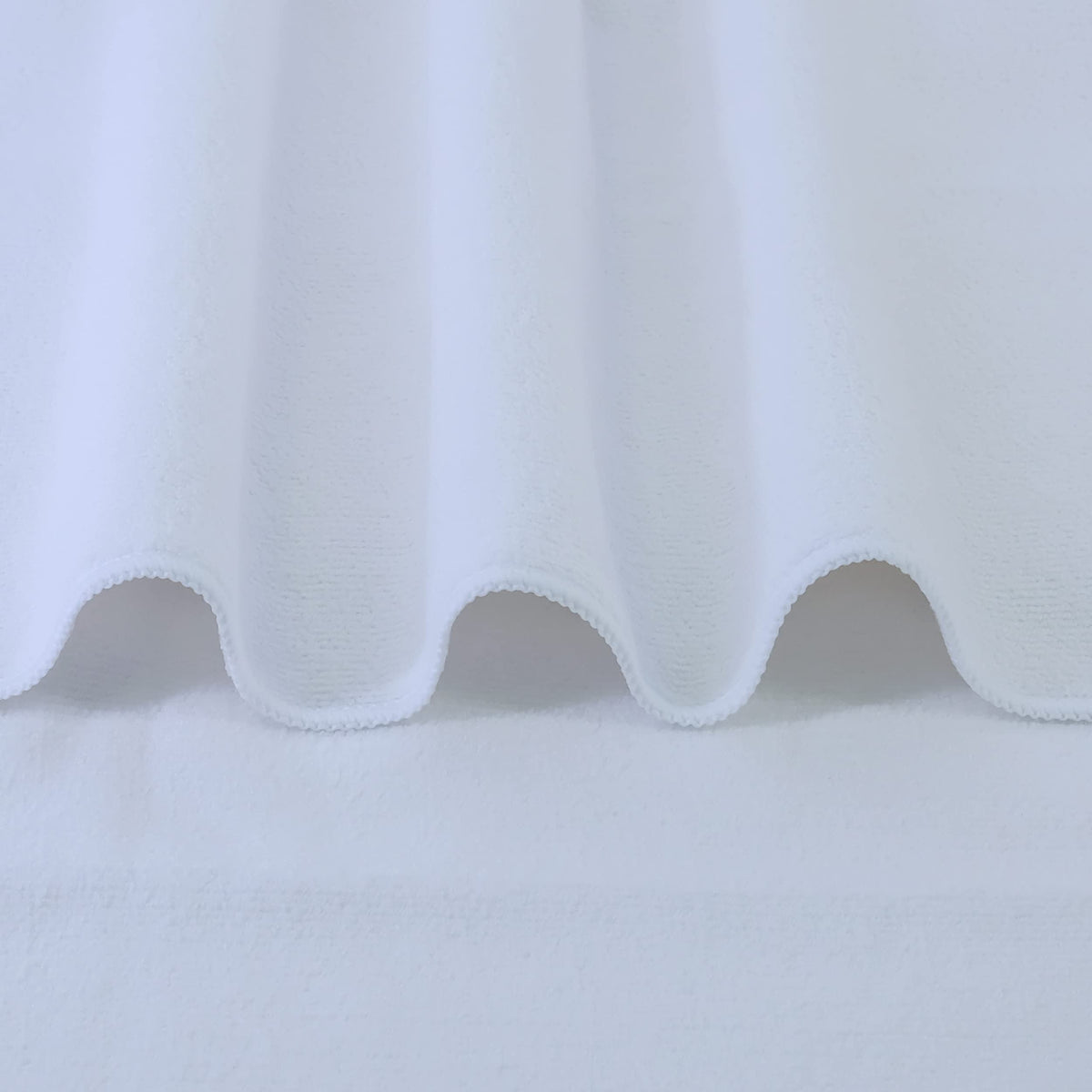 POLYTE towel wrapped around long hair demonstrating fast drying and frizz reduction