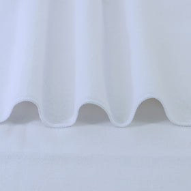 POLYTE towel wrapped around long hair demonstrating fast drying and frizz reduction