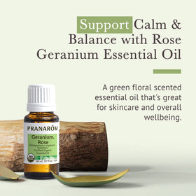 Pranarom bottle with dropper dispensing rose geranium oil, shows precise dosing for blends