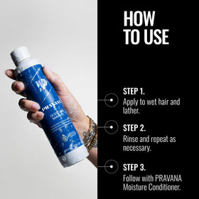 Hand holding Pravana 10 fl oz bottle showing scale and travel-friendly size