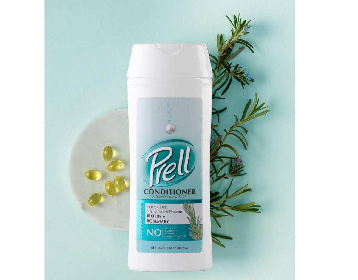 Prell conditioner texture on fingers showing lightweight hydration benefit